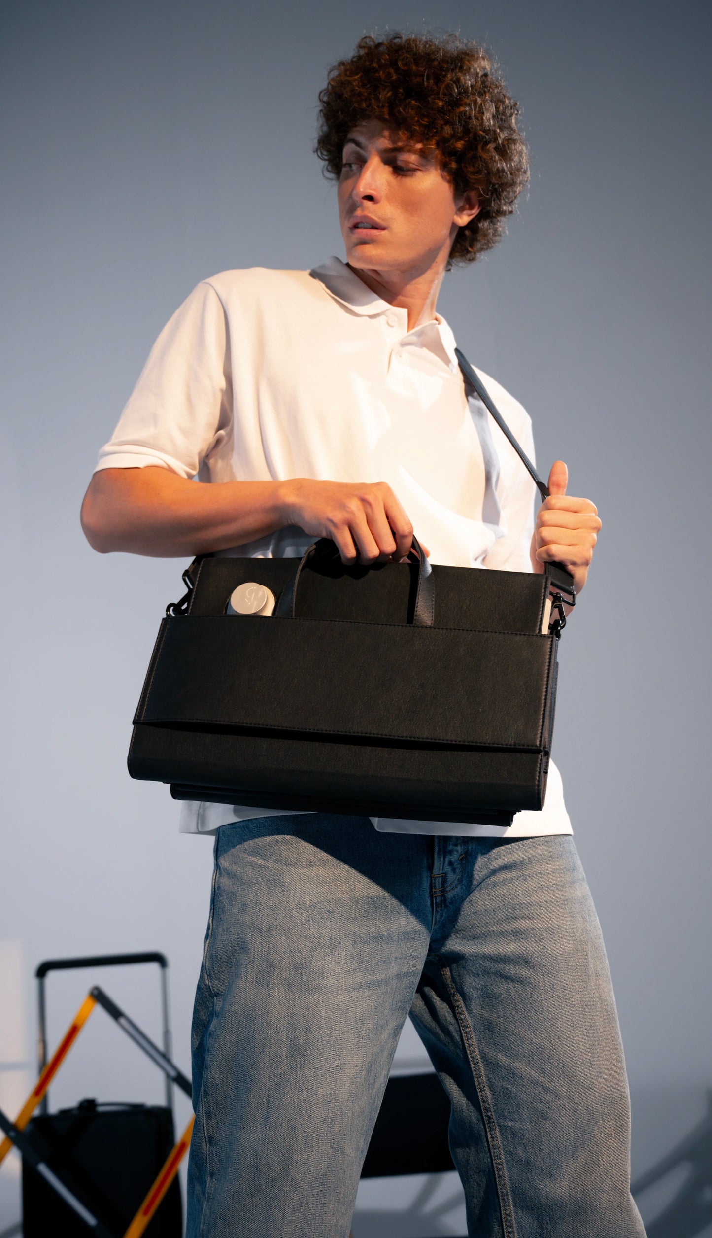 Stylish men’s laptop briefcase with crossbody strap and minimalist design for everyday carry
