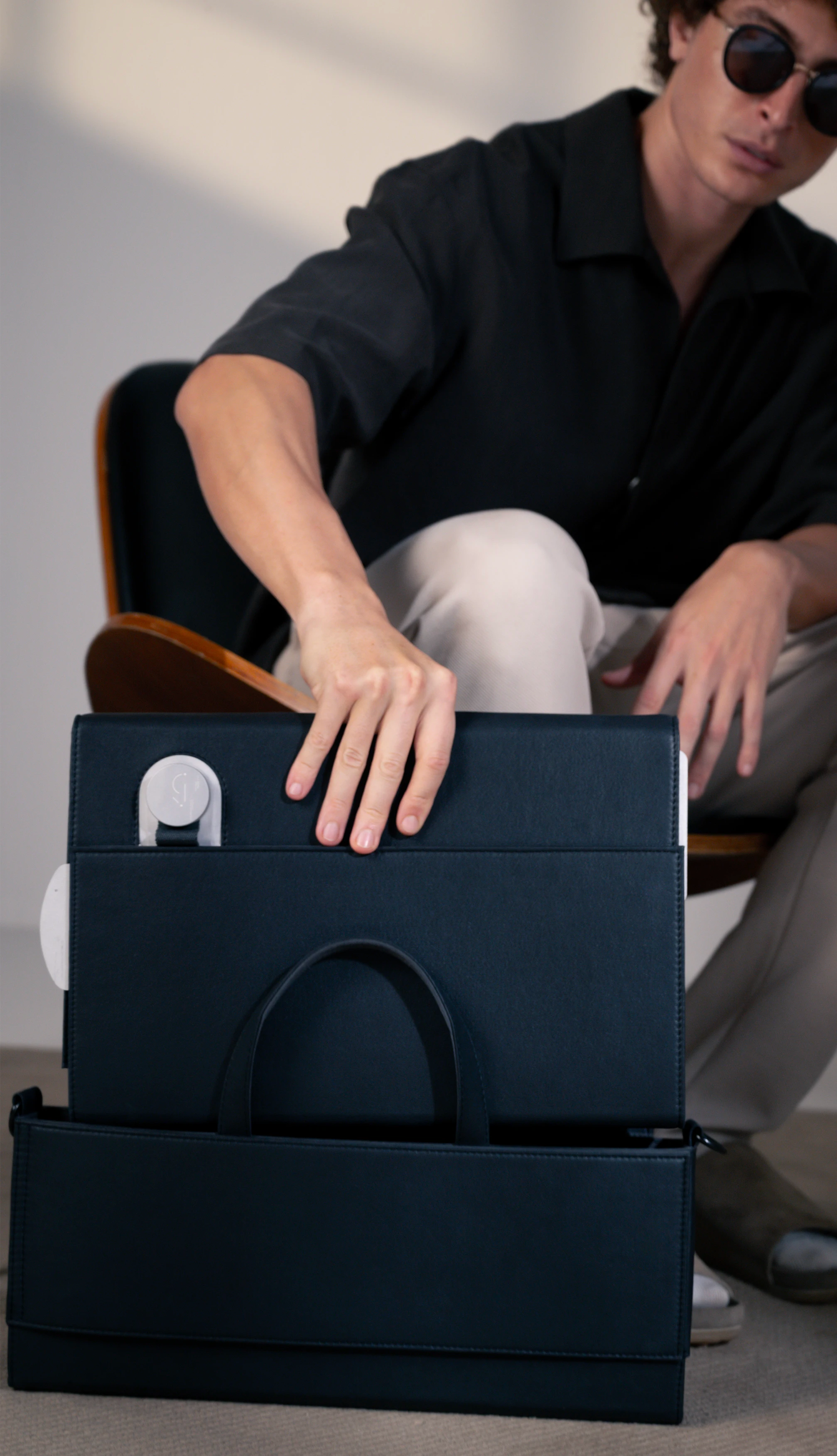 Charcoal dossier that fits into the brief for functionality