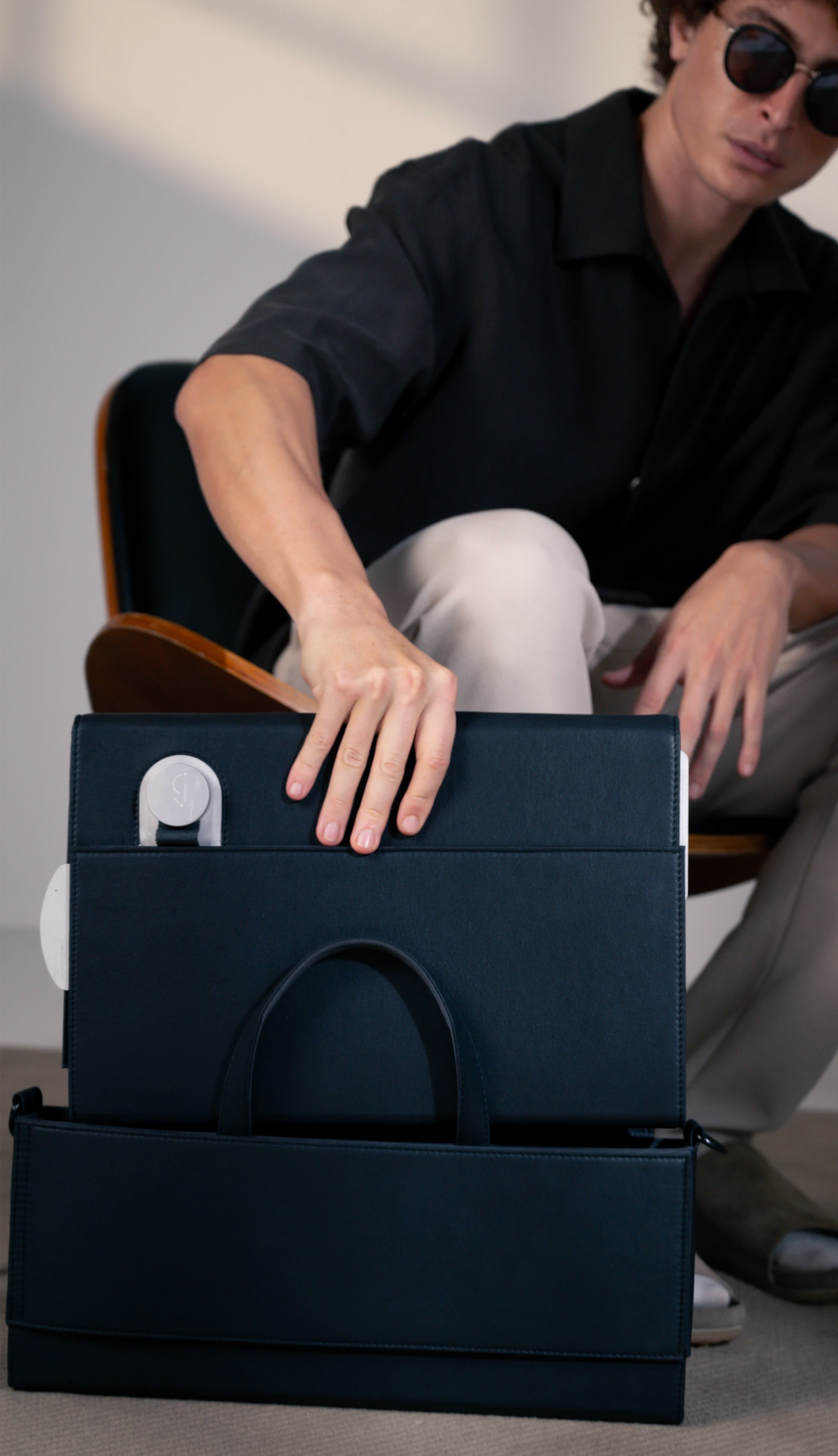 Charcoal dossier that fits into the brief for functionality